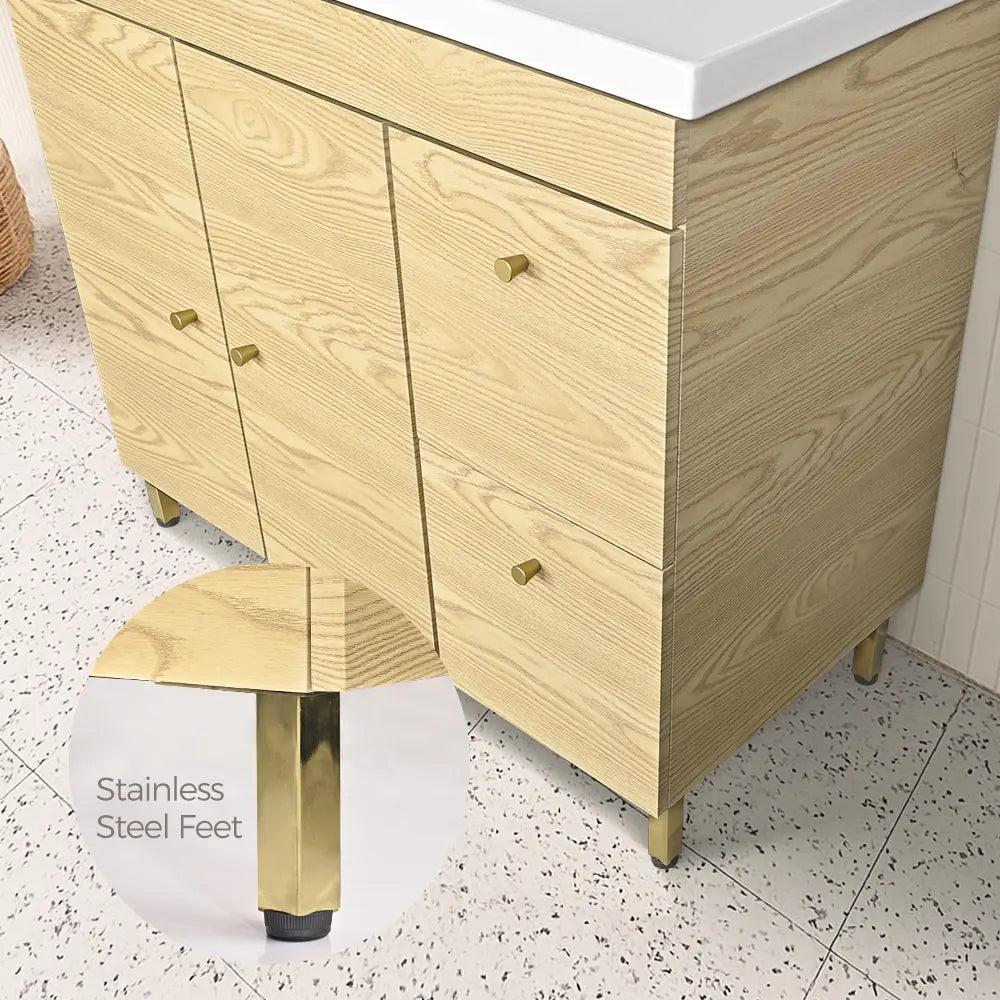Wooden vanity with stainless steel feet on a speckled floor