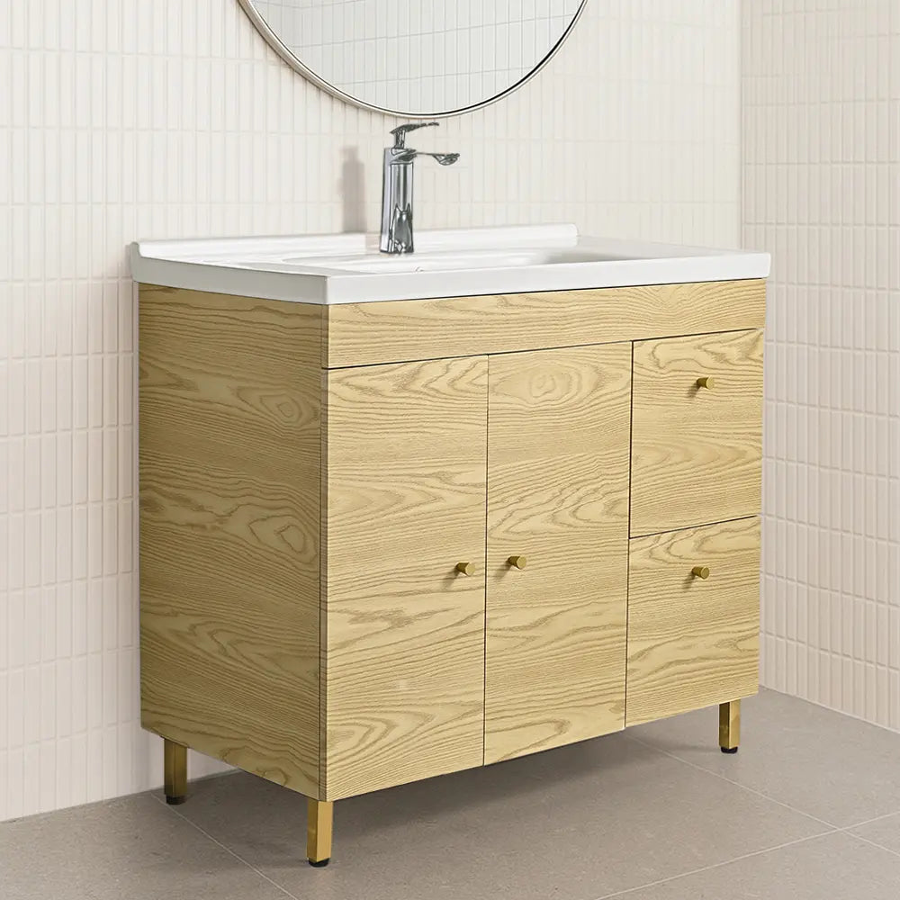 Wooden bathroom vanity with basin and mirror in a tiled bathroom