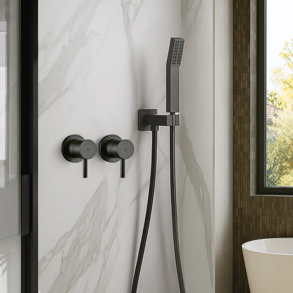 Black shower system mounted on a marble wall with a window in the background.