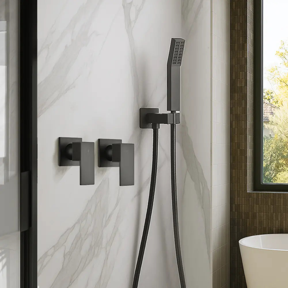 Black shower control panel with handheld shower head mounted on a marble wall.