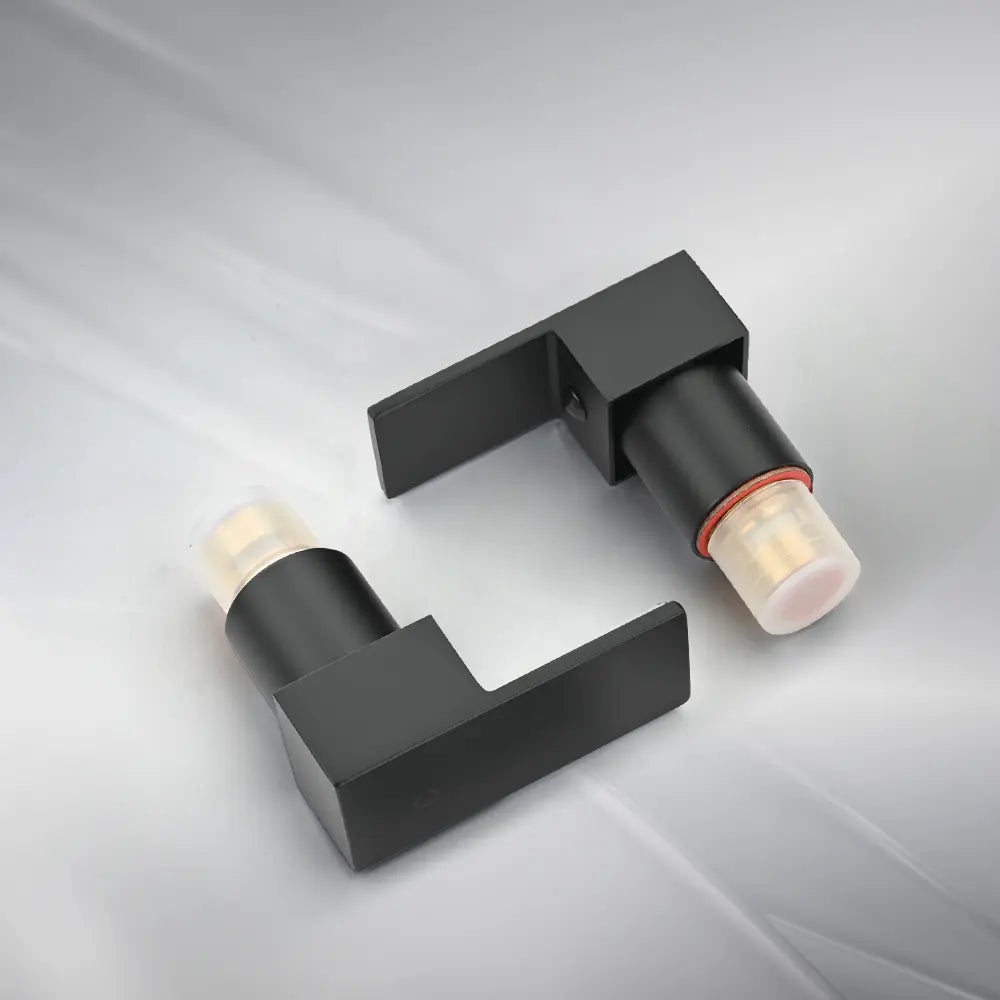 Black shower mixer valve handles with durable brass cartridge insert and protective caps – modern bathroom tap fittings