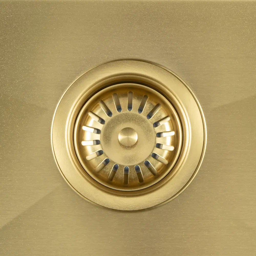 Close-up of Sima-X sink’s stainless steel strainer in gold
