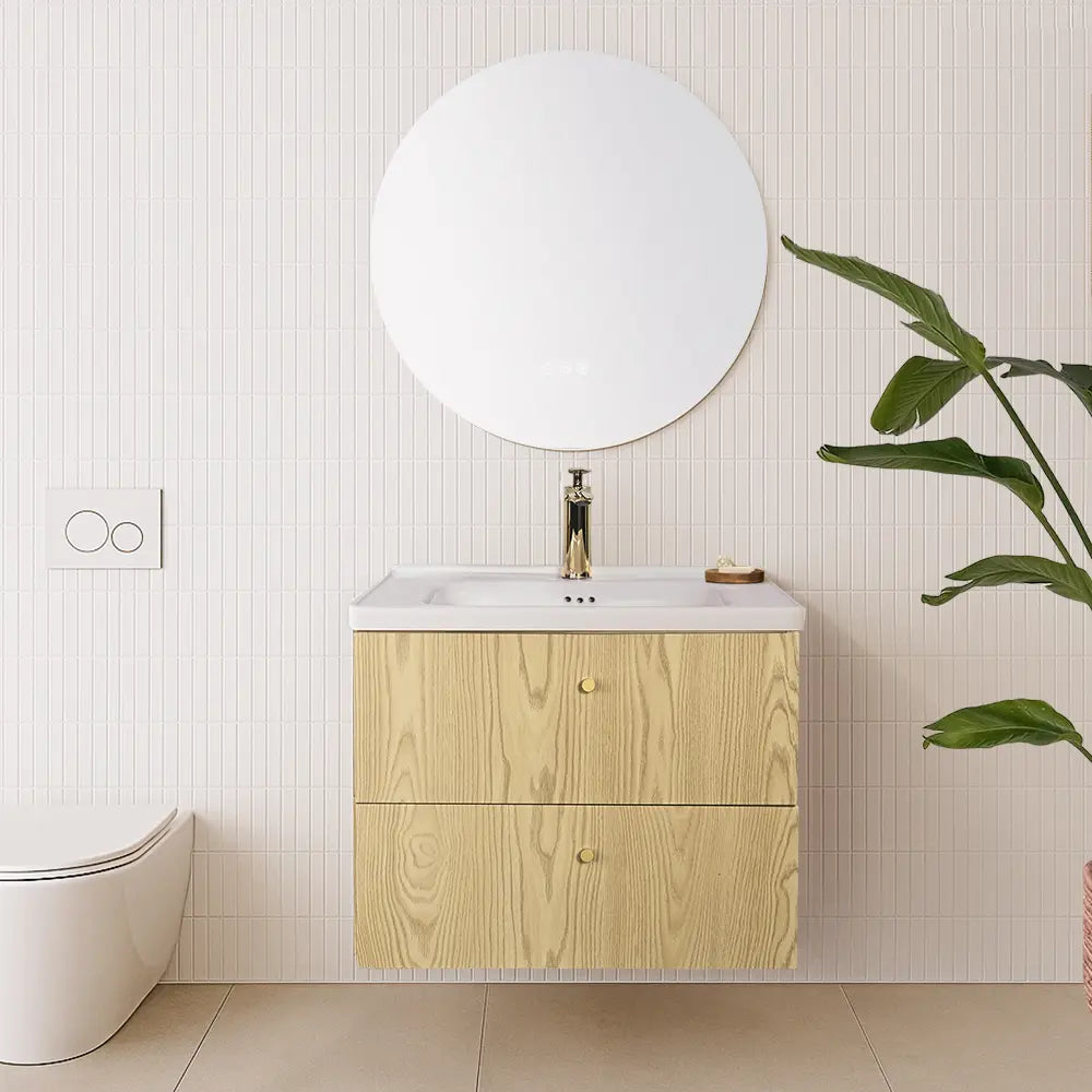 Bathroom with wooden vanity, round mirror, and smart toilet.