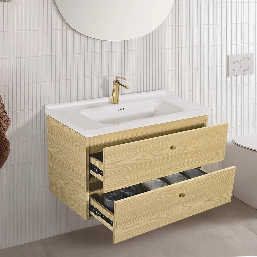 Bathroom vanity with sink and open drawers against a tiled wall.