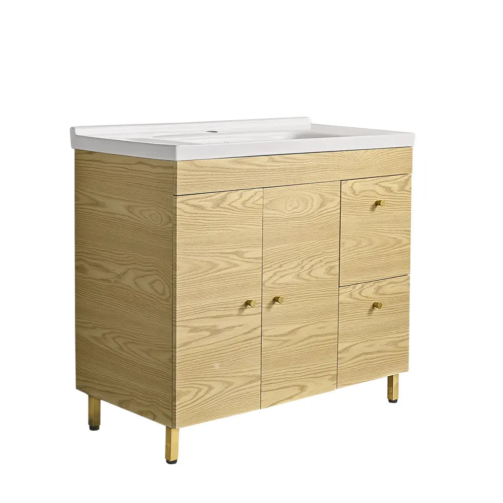 Modern light oak bathroom vanity with white ceramic basin, gold handles, and storage drawers – stylish freestanding bathroom cabinet for contemporary Australian homes