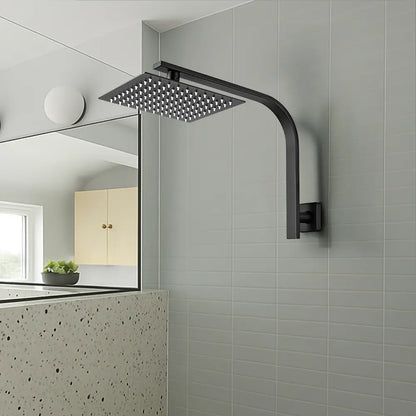 Black shower head mounted on a tiled bathroom wall