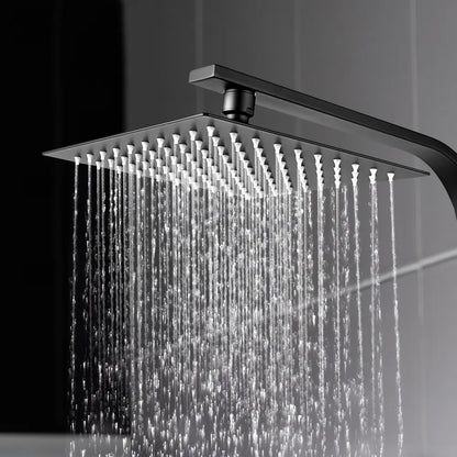 Square shower head with water flowing in a bathroom setting
