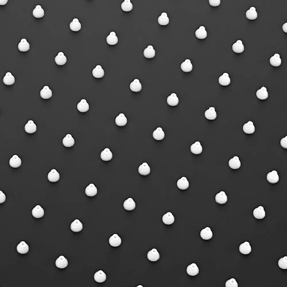 White polka dots on shower head