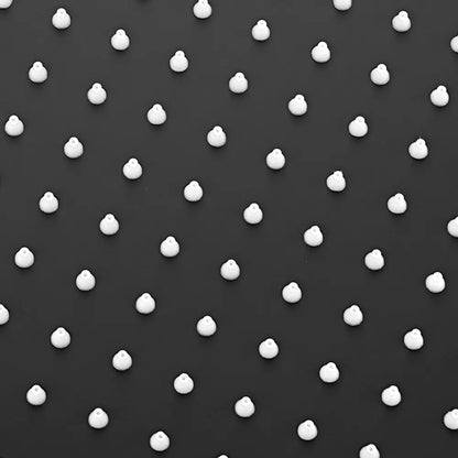 White polka dots on shower head